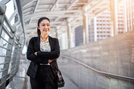 business woman with arms crossed in the cityの写真素材