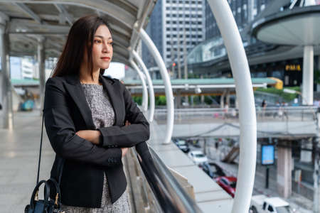 business woman with arms crossed in the cityの写真素材
