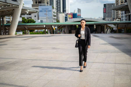 business woman walking in the cityの写真素材