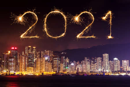 2021 Happy New Year fireworks celebrating over Hong Kong cityscape at nightの写真素材