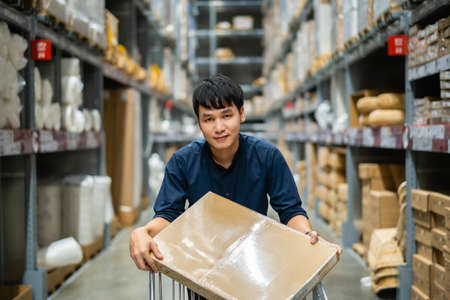 man looking and shopping in the warehouse storeの写真素材