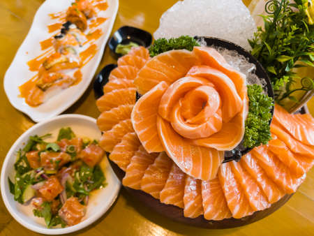 japanese food, fresh salmon sashimi (flower shape), slamon salat, shushi salmonの写真素材