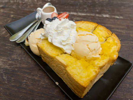 honey toast with ice cream on dishの写真素材