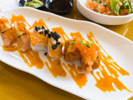 Sushi roll with salmon on dish, Japanese foodの写真素材
