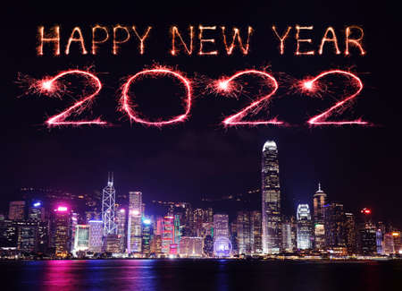 2022 Happy New Year fireworks celebrating over Hong Kong cityscape at night