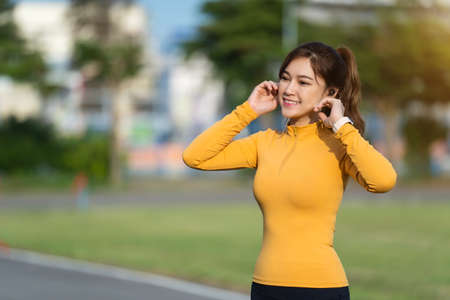 runner woman listening music in the park
