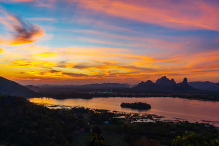 beautiful sunset with Khao Jeen Lae mountain and river at Lopburi, Thailandの写真素材