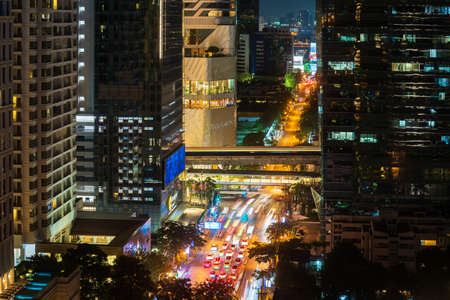 Bangkok, Thailand - April 24 ,2022 : traffic in Witthayu road and sky train at night in Bangkok city, Thailandのeditorial素材