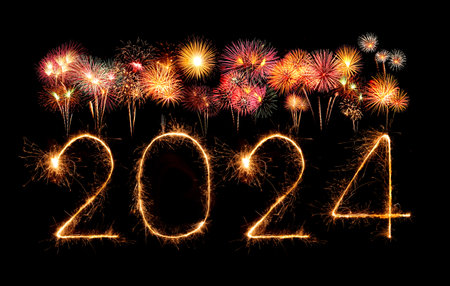 2024 happy new year fireworks celebration written sparkling at the nightの写真素材
