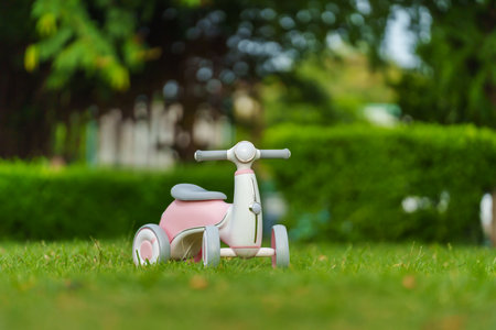 plastic motorcycle toy in the parkの写真素材