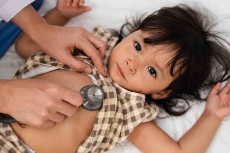 doctor using a stethoscope to istening toddler's chest. baby health conceptの写真素材