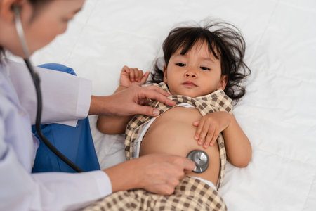doctor using a stethoscope to istening toddler's chest. baby health conceptの写真素材
