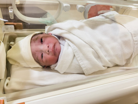 newborn baby in the incubator at hospital