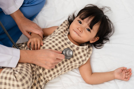 doctor using a stethoscope to istening toddler's chest. baby health conceptの写真素材