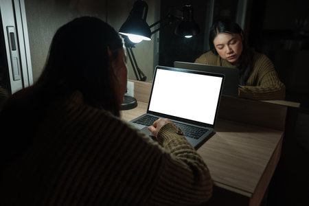 woman working with laptop at a night (with clipping path)の写真素材