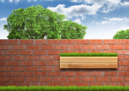 Grown tree with brick wall on green fresh grass. Backgroundの写真素材