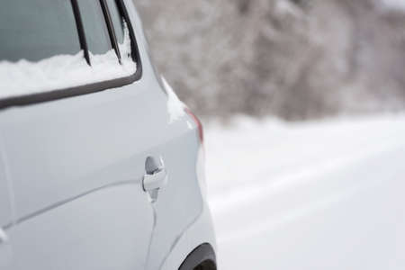 Car in snowy winter forestの写真素材