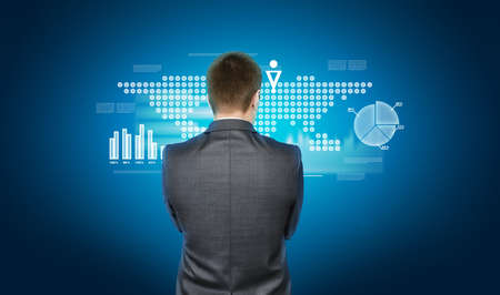 Business concept. Businessman in a suit on background with media and financial iconsの写真素材