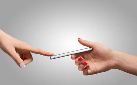 Smartphone in hand. Communication and technologyの写真素材