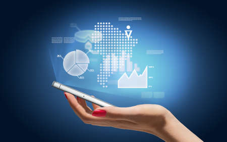 Hand with smartphone and business icons and graphicの写真素材