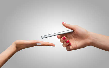 Smartphone in hand. Communication and technologyの写真素材