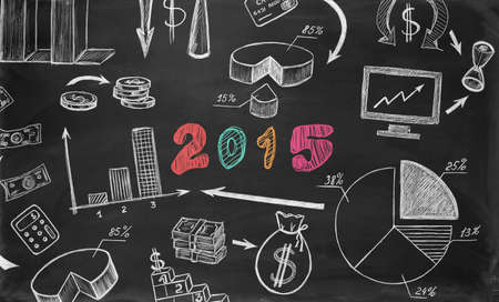 Business sketches on chalkboard with little chalkboardの写真素材