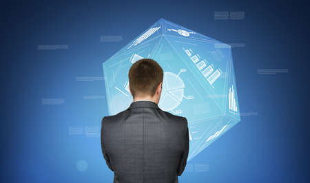 Business concept. Businessman in a suit on background with media and financial iconsの写真素材