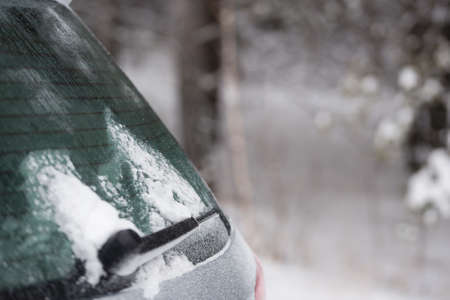 Car in snowy winter forestの写真素材