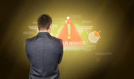 Man in suit is standing back and watching on colorful graphics on yellow blackgroundの写真素材