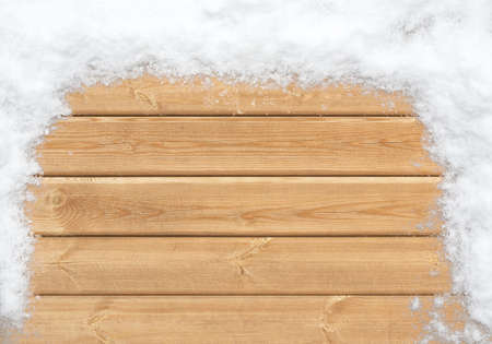 Top view of wooden surface covered with snowの写真素材