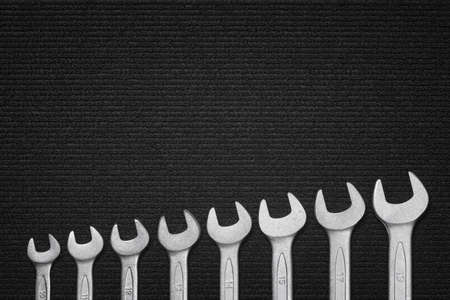 Shiny steel wrenches on a fabric backgroundの写真素材