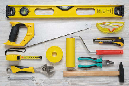Top view of construction instruments and tools on wooden DIY workbench.の写真素材