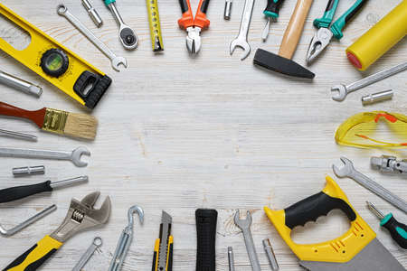 Top view of construction instruments and tools on wooden DIY workbench.の写真素材