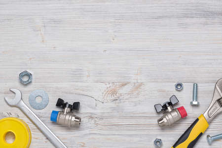 Top view of construction instruments and tools on wooden DIY workbench with open space at center.の写真素材