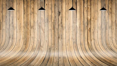 Wooden wall and floor with shining lamp on topの写真素材