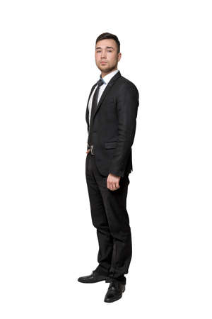 Full portrait of young business man, put his hand in pocket, isolated on white backgroundの写真素材
