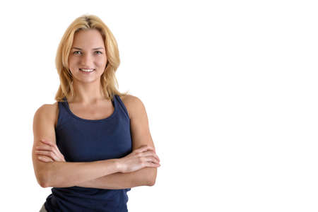 Beautiful smiling fitness woman wearing black sport pants and purple sport shoes isolated on white backgroundの写真素材