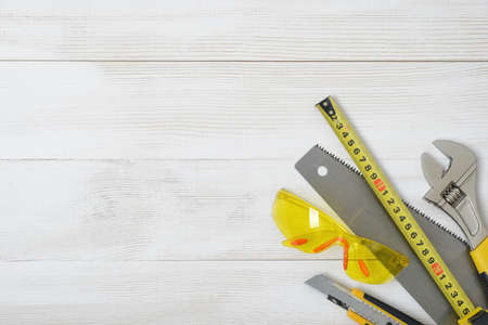Top view of construction instruments and tools on wooden DIY workbench.の写真素材