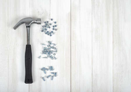 Set of tools for constructing and manufacturing including nuts, screws, nail and hammer. Top view.の写真素材
