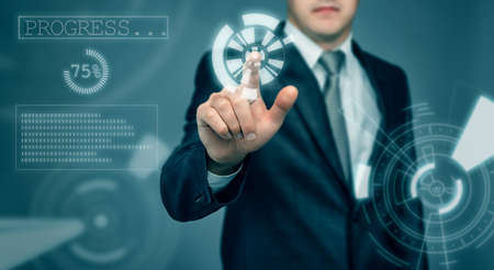 Businessman touching the digital touch screen by his finger. Innovative technology. New future. Thriving society. Modern presentation. Cropped photo.の写真素材