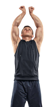 Waist-up portrait of handsome muscled young man posing for the camera. Self improvement. Body power...