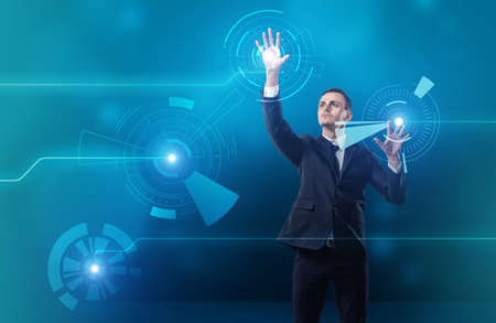 Businessman touching digital touchscreen with both hands.の写真素材