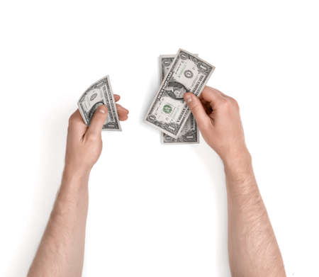 Close-up hands of man counting money on white background.の写真素材