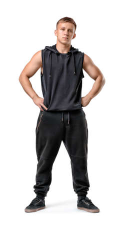 Full length portrait of muscled young man with his hands on hips, isolated on white background.の写真素材