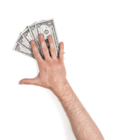 Close up view of a man's hand lying on dollar bills, isolated on white background.の写真素材