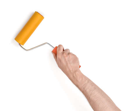 Close-up view of a man's hand with a paint roller, isolated on white background.
