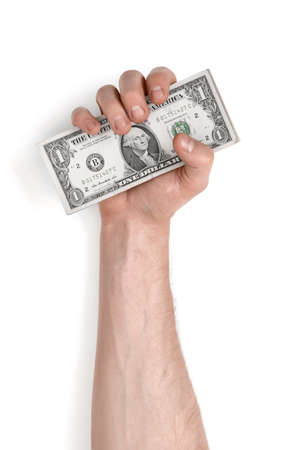 Close-up view of a man's hand holding one-dollar banknotes, isolated on white background.の写真素材