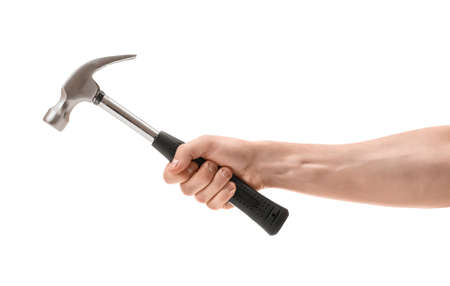 Close-up view of a man's hand holding hammer, isolated on white background.の写真素材