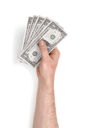 Close up view of a man's hand holding one dollar bills isolated on white background. Money and currency. Paying and buying.の写真素材