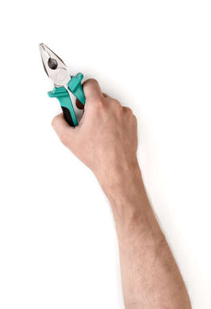 Close-up view of a man's hand holding pliers isolated on white background.の写真素材